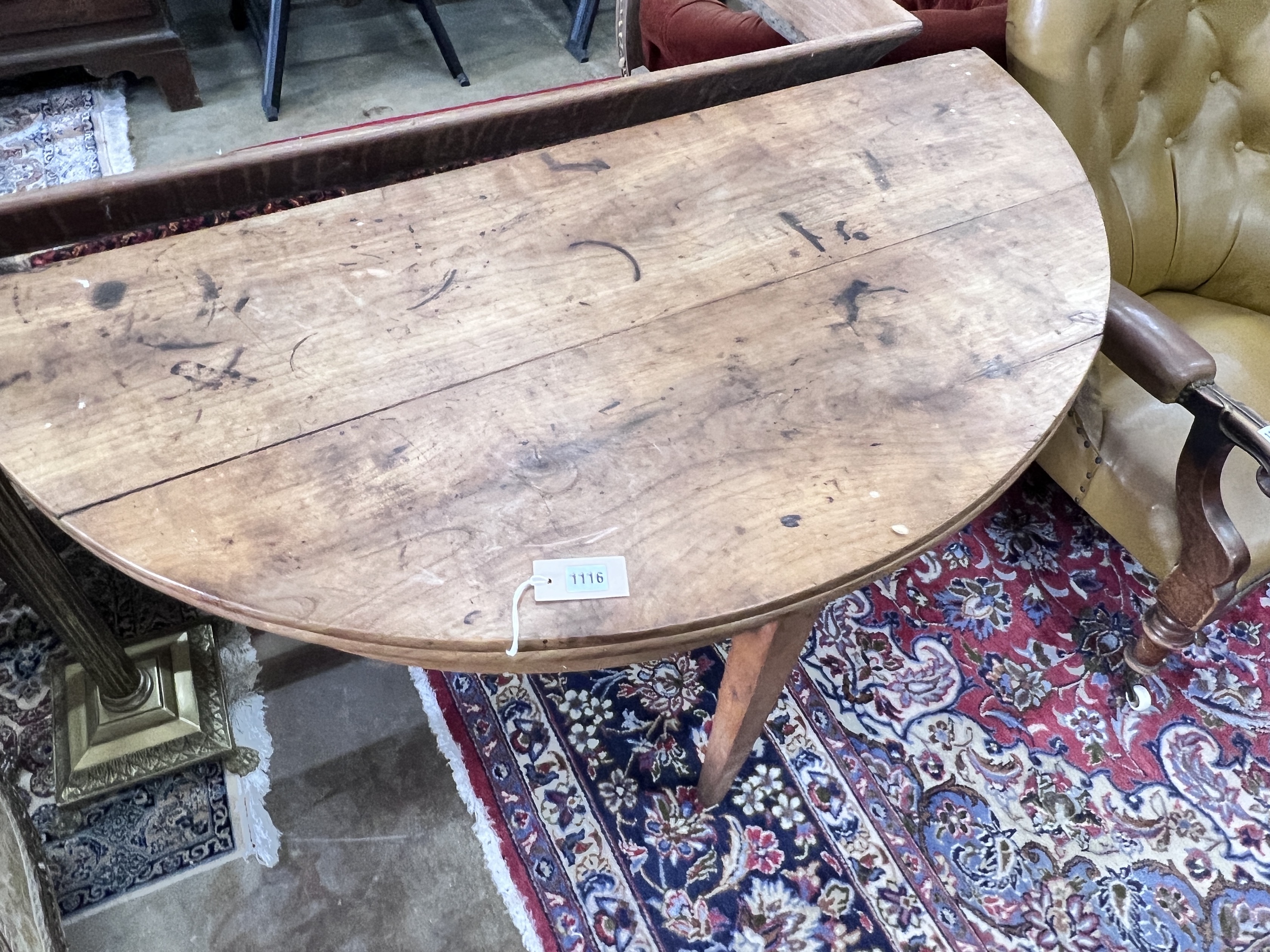 An early 19th century continental fruitwood D shaped folding tea table, width 124cm, depth 60cm, height 73cm